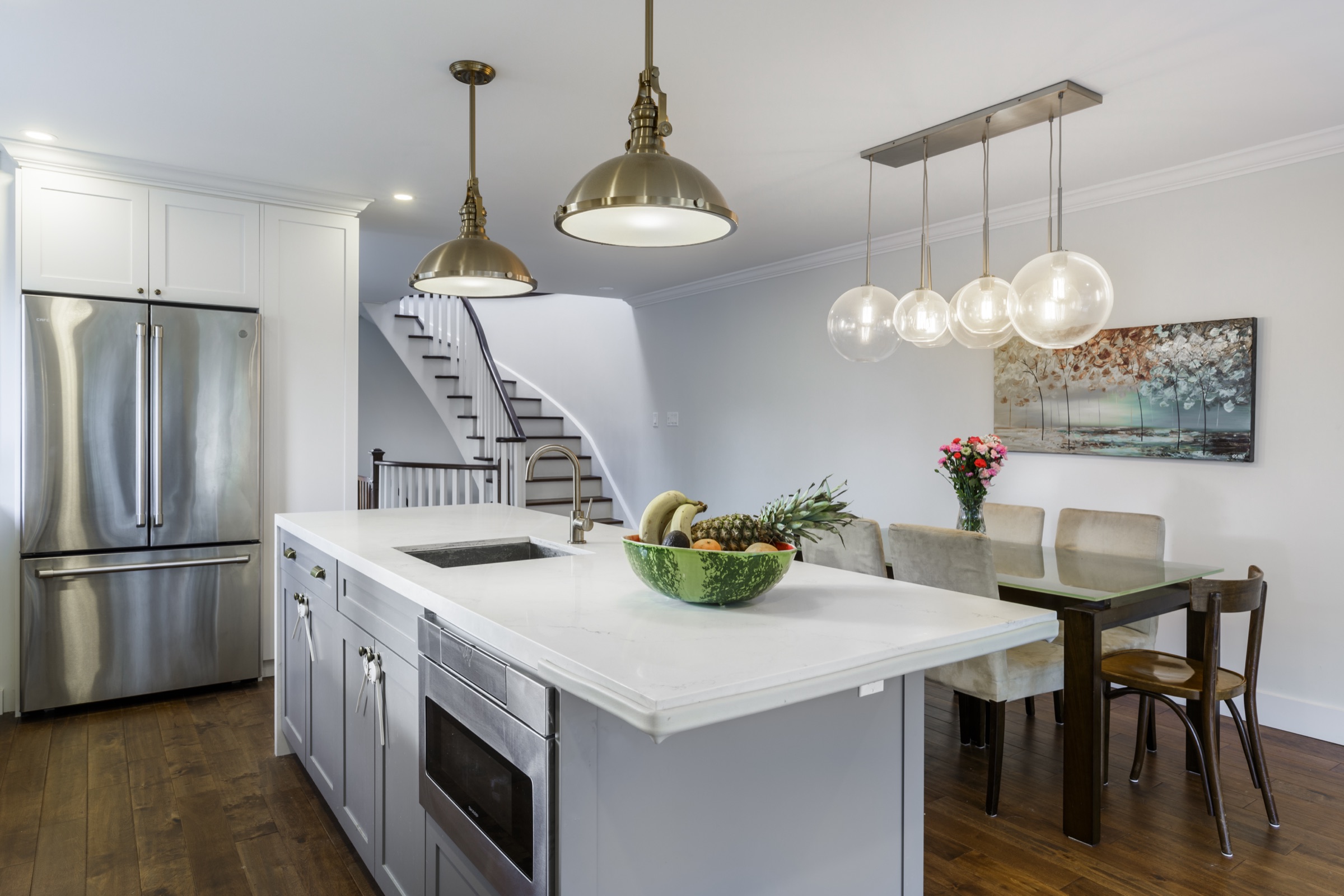 Light framed kitchen with a central island
